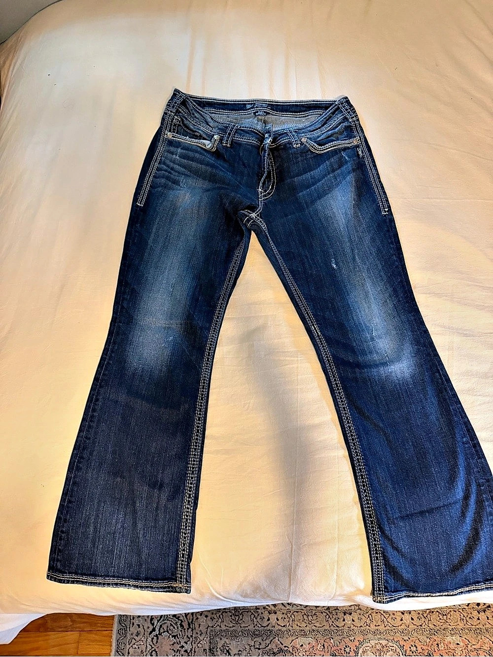 Silver Jeans Co. Suki Surplus Mid Rise Bootcut Jeans. Blue